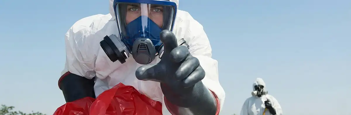 sewage clean up technician wearing protective gear handling biohazard materials in Orlando, FL