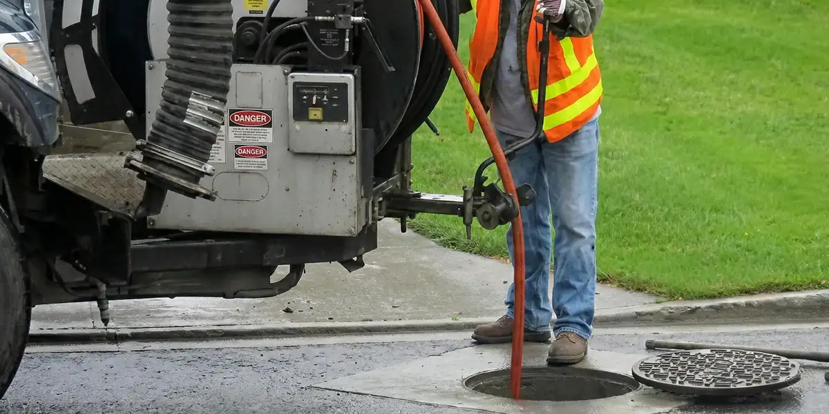 sewage clean up professionals using industrial equipment to remove contaminated wastewater in Orlando, FL