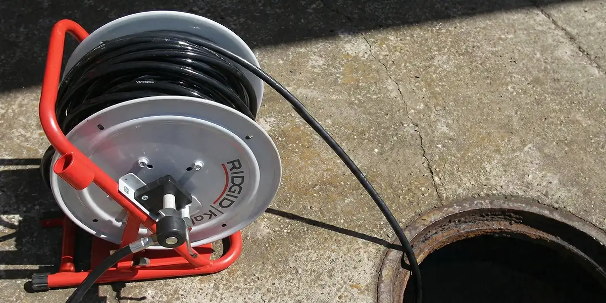 sewer rodding equipment prepared to clear clogged sewer lines in Orlando, FL