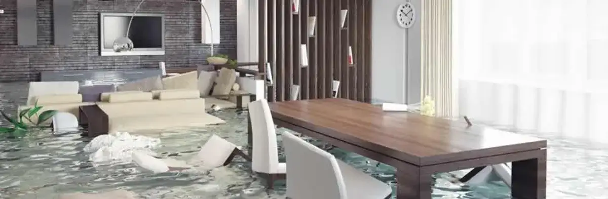 home interior affected by water damage with flooded floors and displaced furniture in Orlando, FL